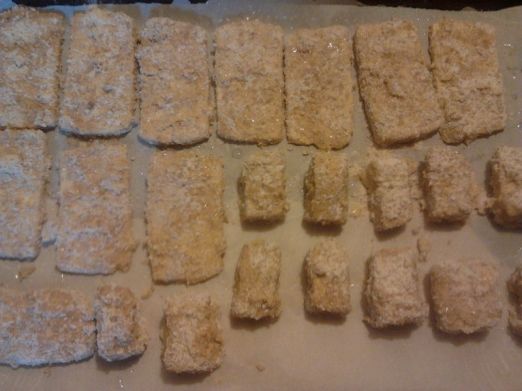 Pre-baking breaded tofu. I make the cubes for supper, and the slabs for making sandwiches during the upcoming week.